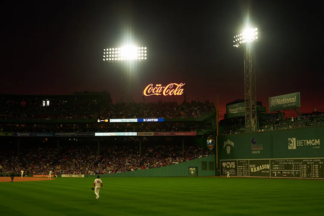 The Coca-Cola sign above the stands at Fenway Park at night